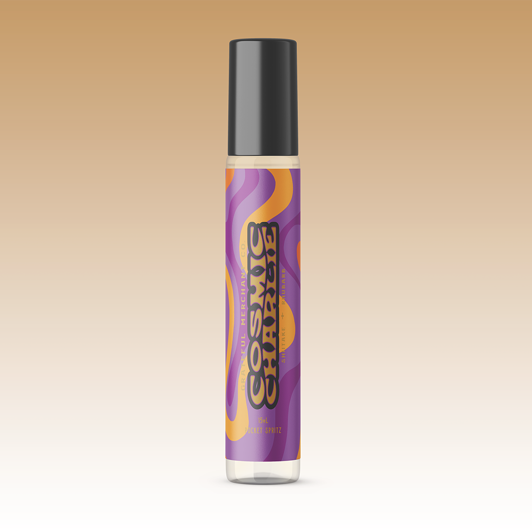 A bottle of Cosmic Charlie EDP perfume with a purple label and a black cap.